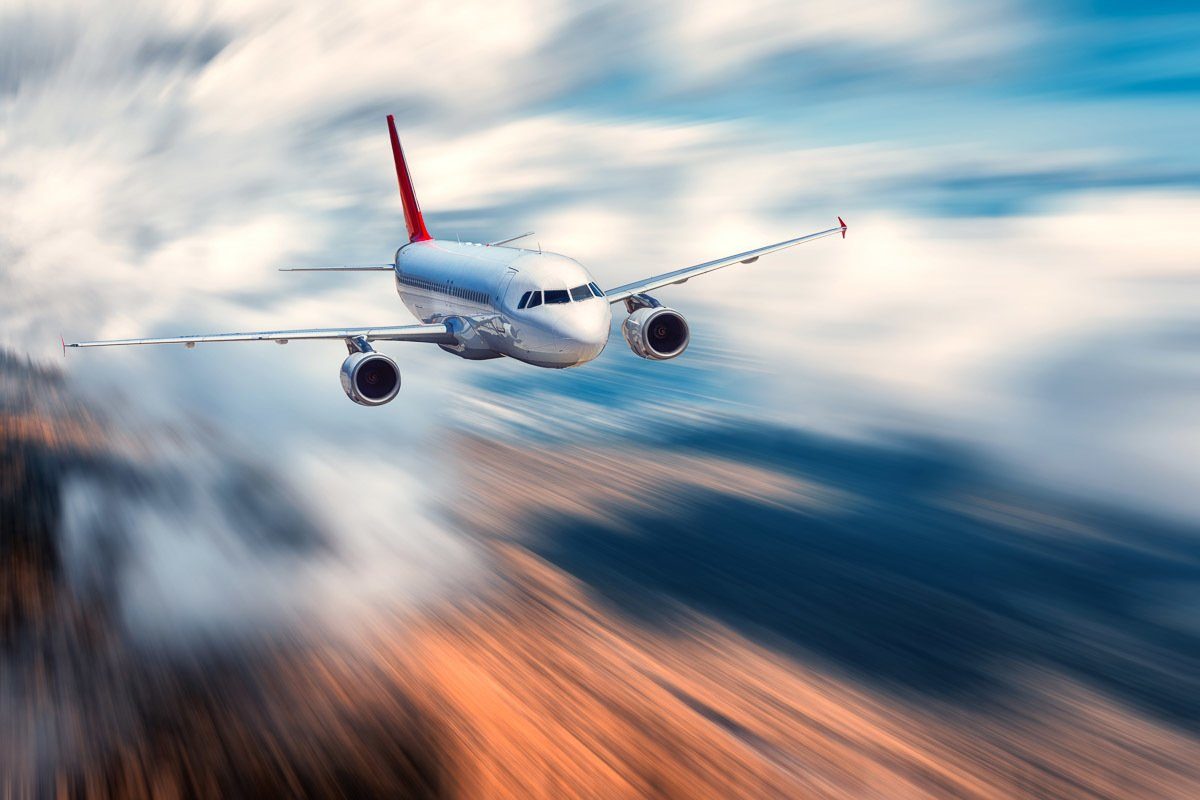 Fototapete Fliegendes Flugzeug