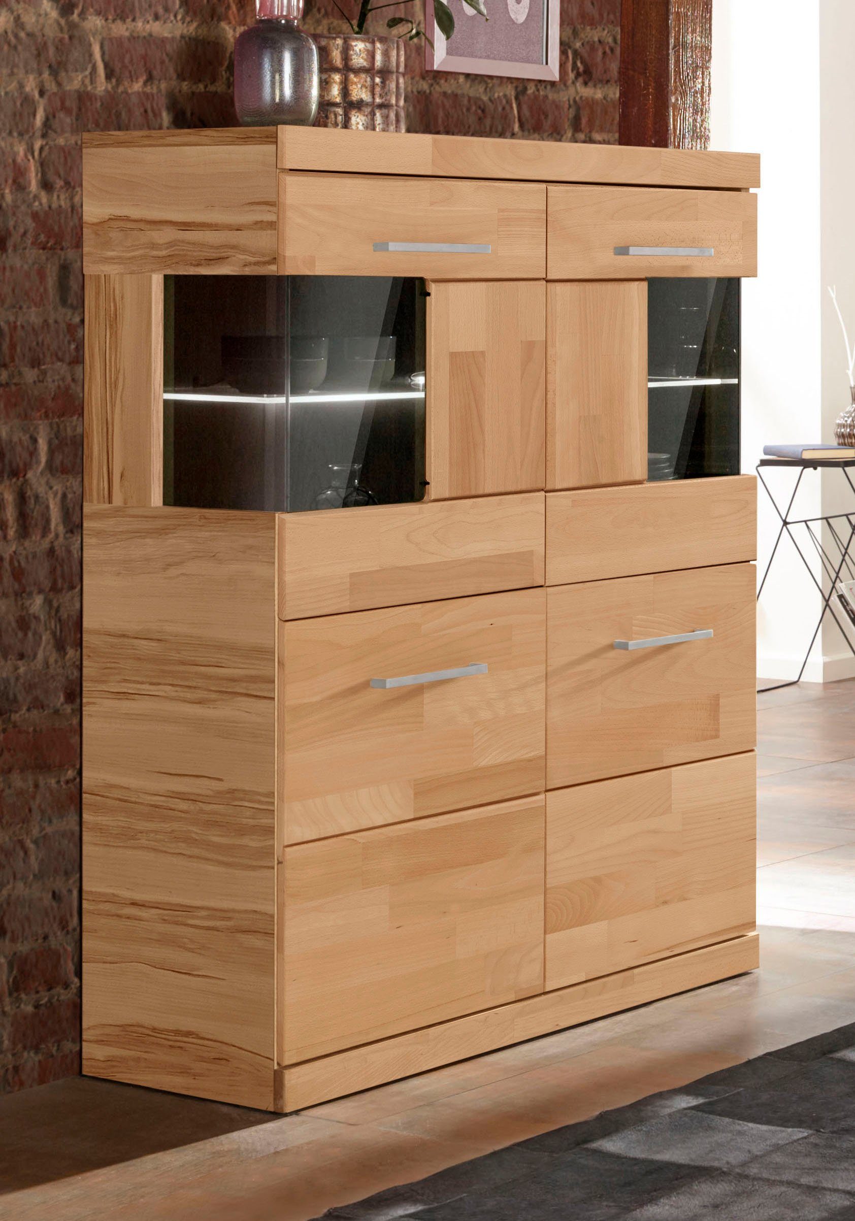 OTTO home Highboard Ribe,85cm breit,115cm hoch, Fronten Massivholz,4 breite Fächer, Korpus Holzwerkstoff,2Türen mit Glaseinsatz, Böden versetzbar