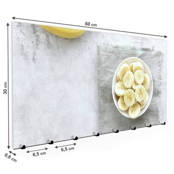 Primedeco Garderobenpaneel Magnetwand und Memoboard aus Glas Bananen in Schale auf Tisch