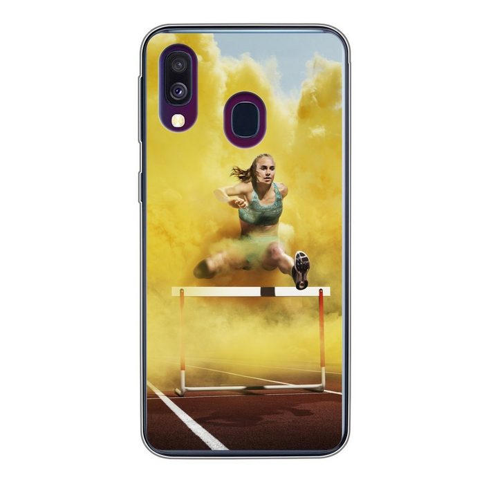 MuchoWow Handyhülle Sportler springt durch gelben Rauch Handyhülle Samsung Galaxy A40 Smartphone-Bumper Print Handy