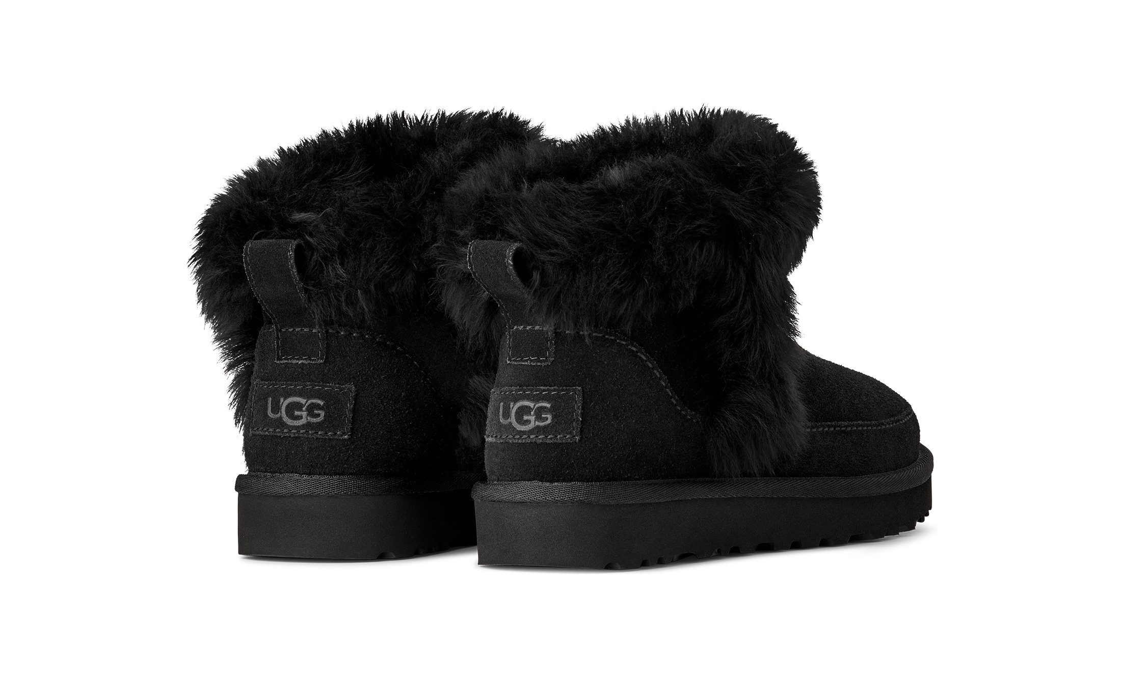 UGG Classic Ultra Mini Chalet Winterboots Ankleboots, Schlupfboots mit modischer Schaffell Verzierung