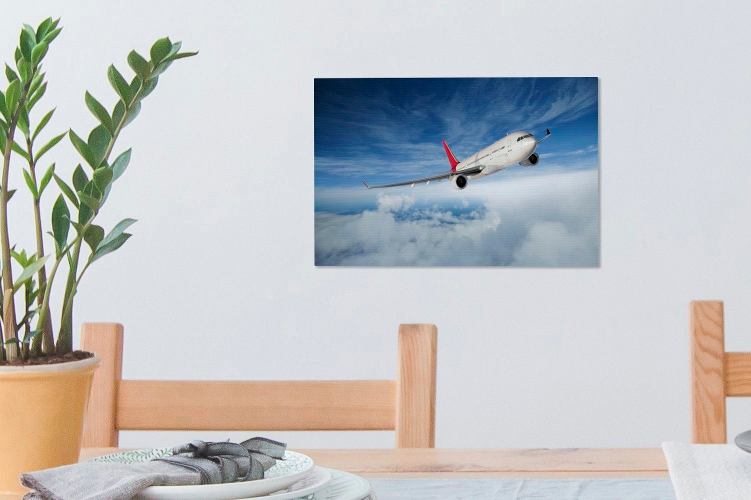 Leinwandbilder, eines Eine OneMillionCanvasses® 30x20 St), bewölktem bei Illustration Aufhängefertig, Flugzeugs Wandbild Leinwandbild Himmel, (1 cm Wanddeko,