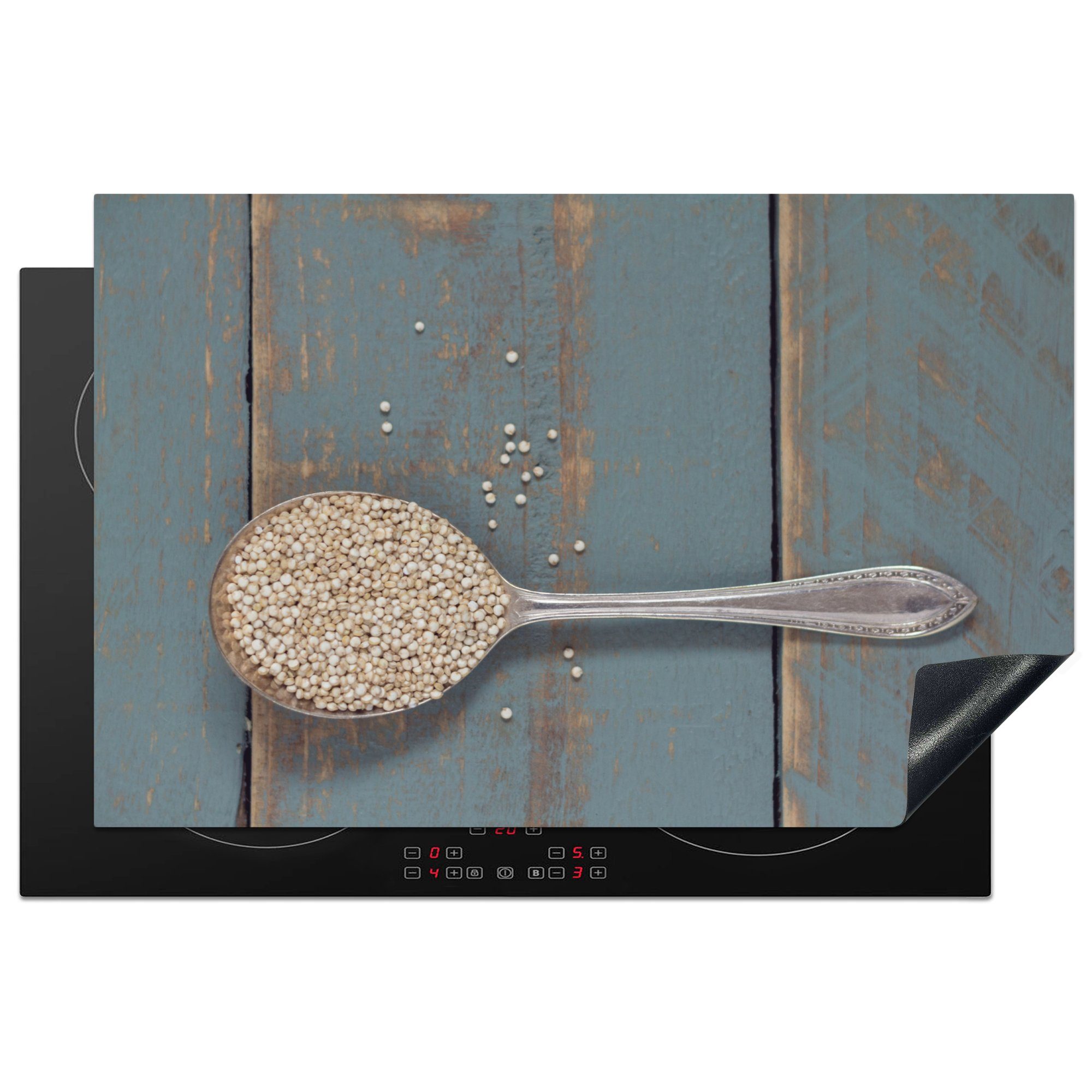 MuchoWow Herdblende-/Abdeckplatte Ein alter Löffel mit Quinoa auf einem Holztisch, Vinyl, (1 tlg), 81x52 cm, Induktionskochfeld Schutz für die küche, Ceranfeldabdeckung