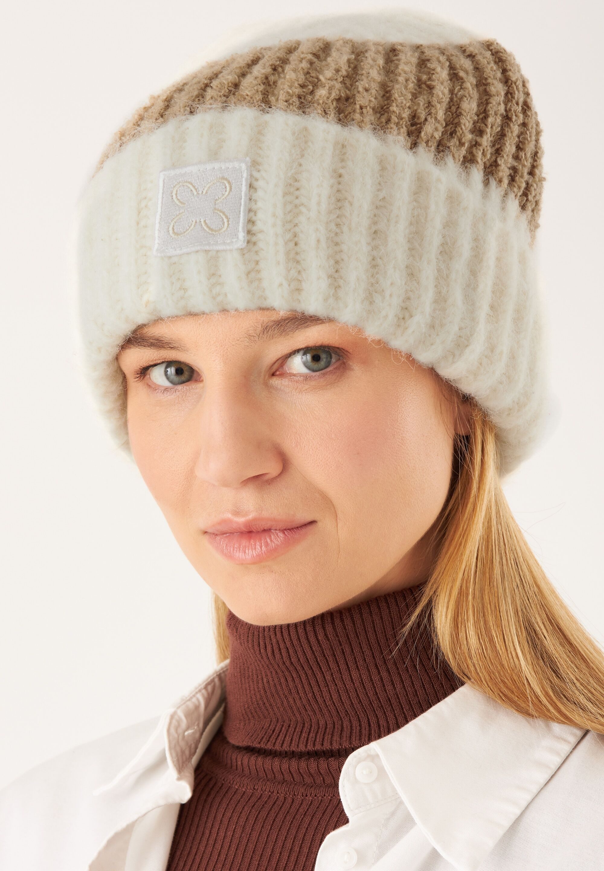 Codello Strickmütze (1-St) aus Bouclé- und Rippstrick günstig online kaufen