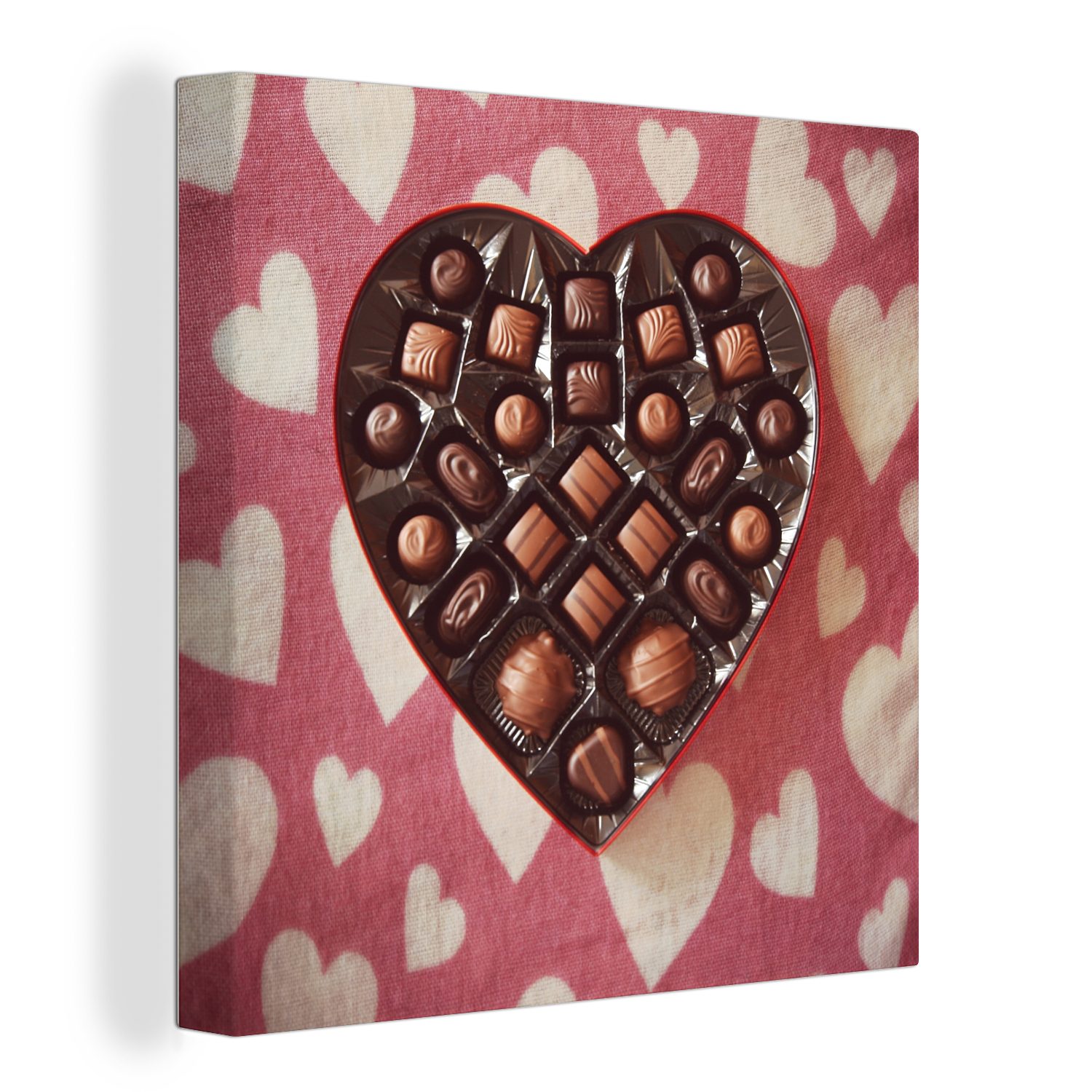 OneMillionCanvasses® Leinwandbild Die Bonbons sind in einer Schachtel in Form eines Herzens verpackt, (1 St), Leinwand Bilder für Wohnzimmer Schlafzimmer | Leinwandbilder