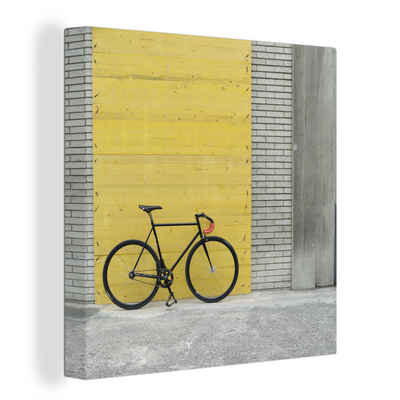 OneMillionCanvasses® Leinwandbild Ein Rennrad vor einem industriellen Hintergrund, (1 St), Leinwand Bilder für Wohnzimmer Schlafzimmer