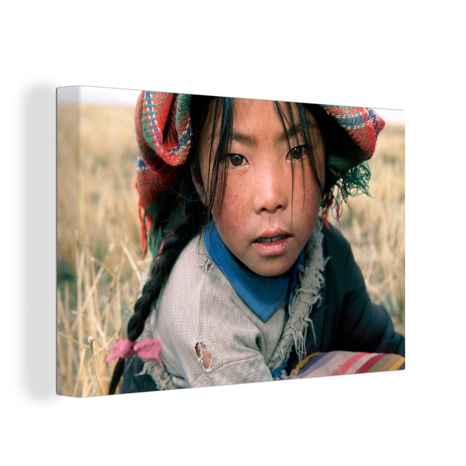 OneMillionCanvasses® Leinwandbild Nahaufnahme eines tibetischen Mädchens in der Landschaft von Tibet, (1 St), Wandbild Leinwandbilder, Aufhängefertig, Wanddeko, 30x20 cm | Leinwandbilder