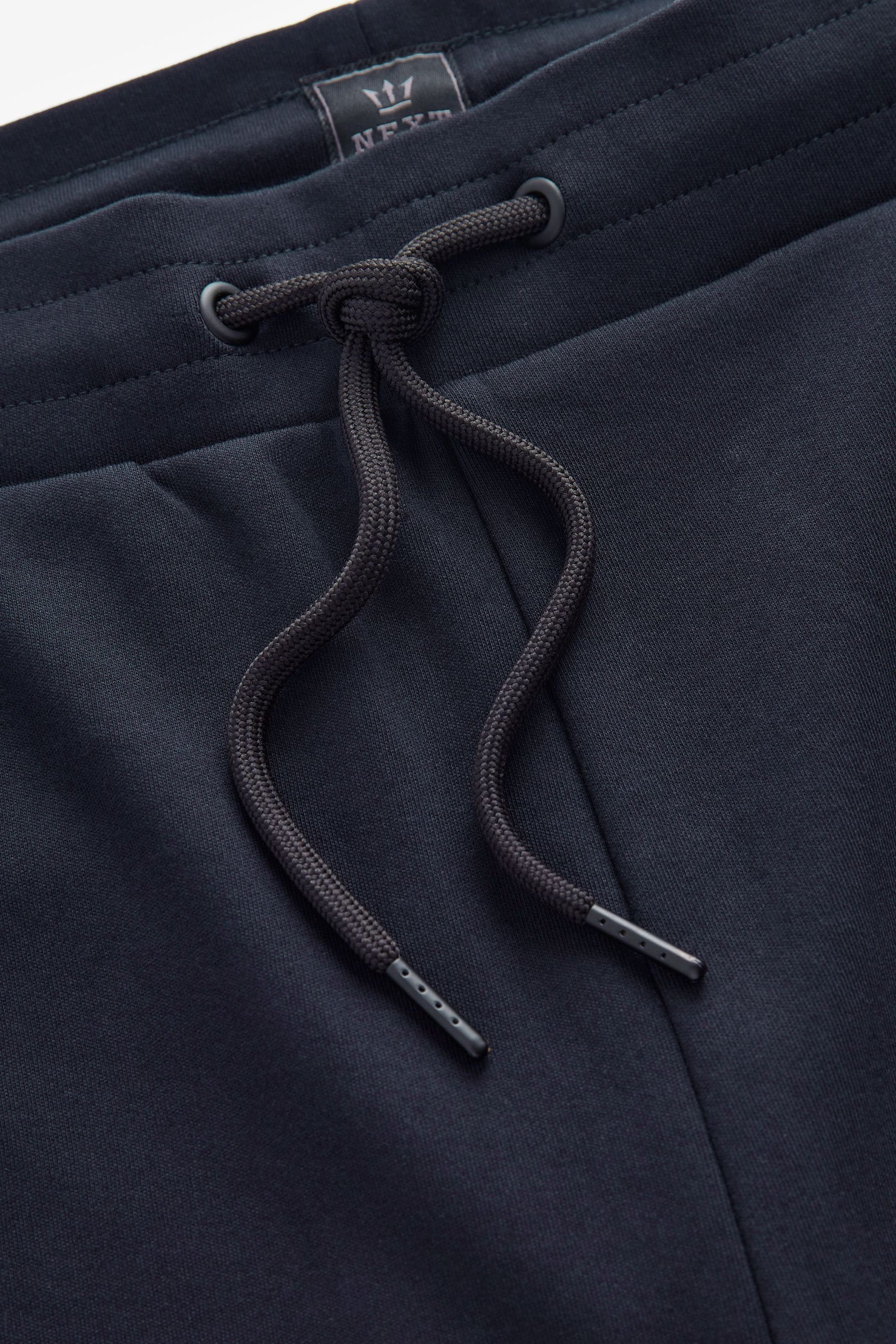 Jersey-Shorts Fit mit Navy Reißverschlusstaschen-Slim (1-tlg) Blue Sweatshorts Next