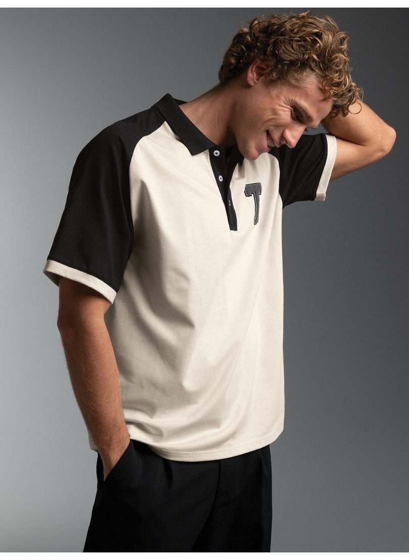 Trigema Poloshirt TRIGEMA Oversized Raglan T Shirt mit trigema Printmotiv (1-tlg)