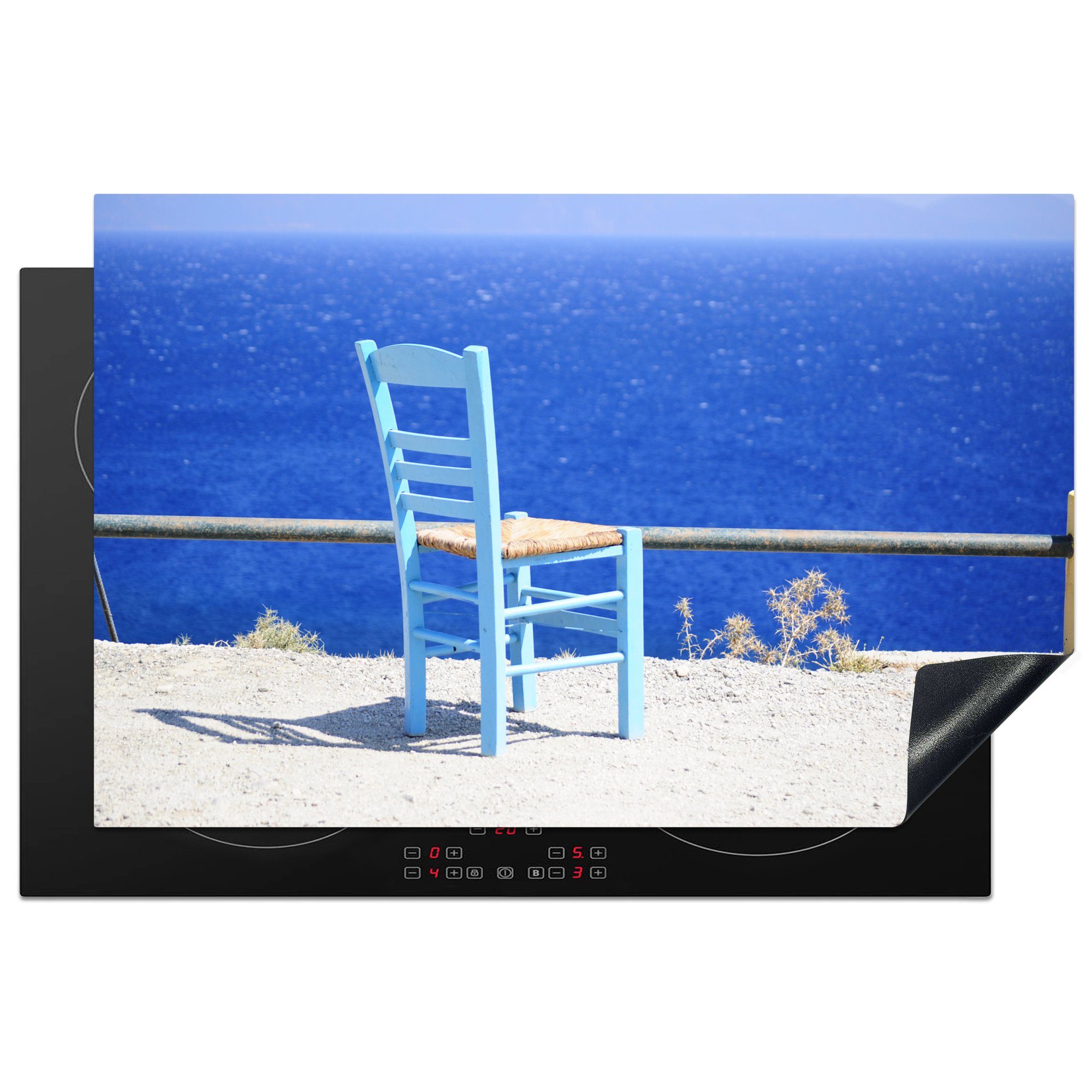 MuchoWow Herdblende-/Abdeckplatte Blick auf das strahlend blaue Meer und einen Stuhl auf Kos, Vinyl, (1 tlg), 81x52 cm, Induktionskochfeld Schutz für die küche, Ceranfeldabdeckung
