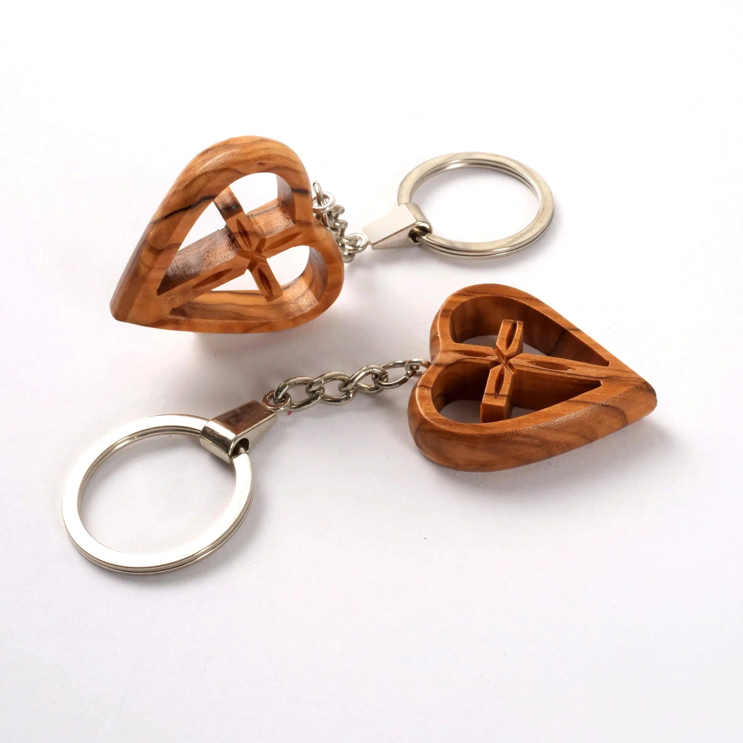 Kassis Schlüsselanhänger Schlüsselanhänger mit Kreuz im Herz aus Olivenholz, handgemacht, umweltfreundlich, Naturprodukt, aus Bethlehem