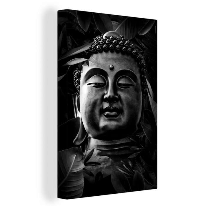 OneMillionCanvasses® Leinwandbild Kopf eines Buddhas mit Blättern - schwarz und weiß (1 St) Leinwandbild fertig bespannt inkl. Zackenaufhänger Gemälde
