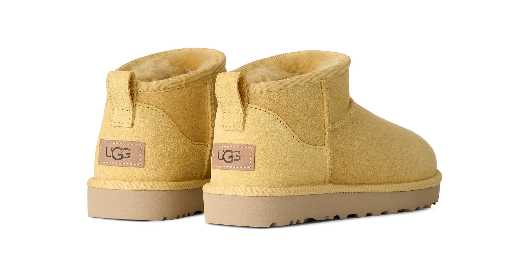 UGG Unisex, W CLASSIC ULTRA MINI Schlupfboots Winterboots mit Ziernähten und Logoaufnäher an der Ferse