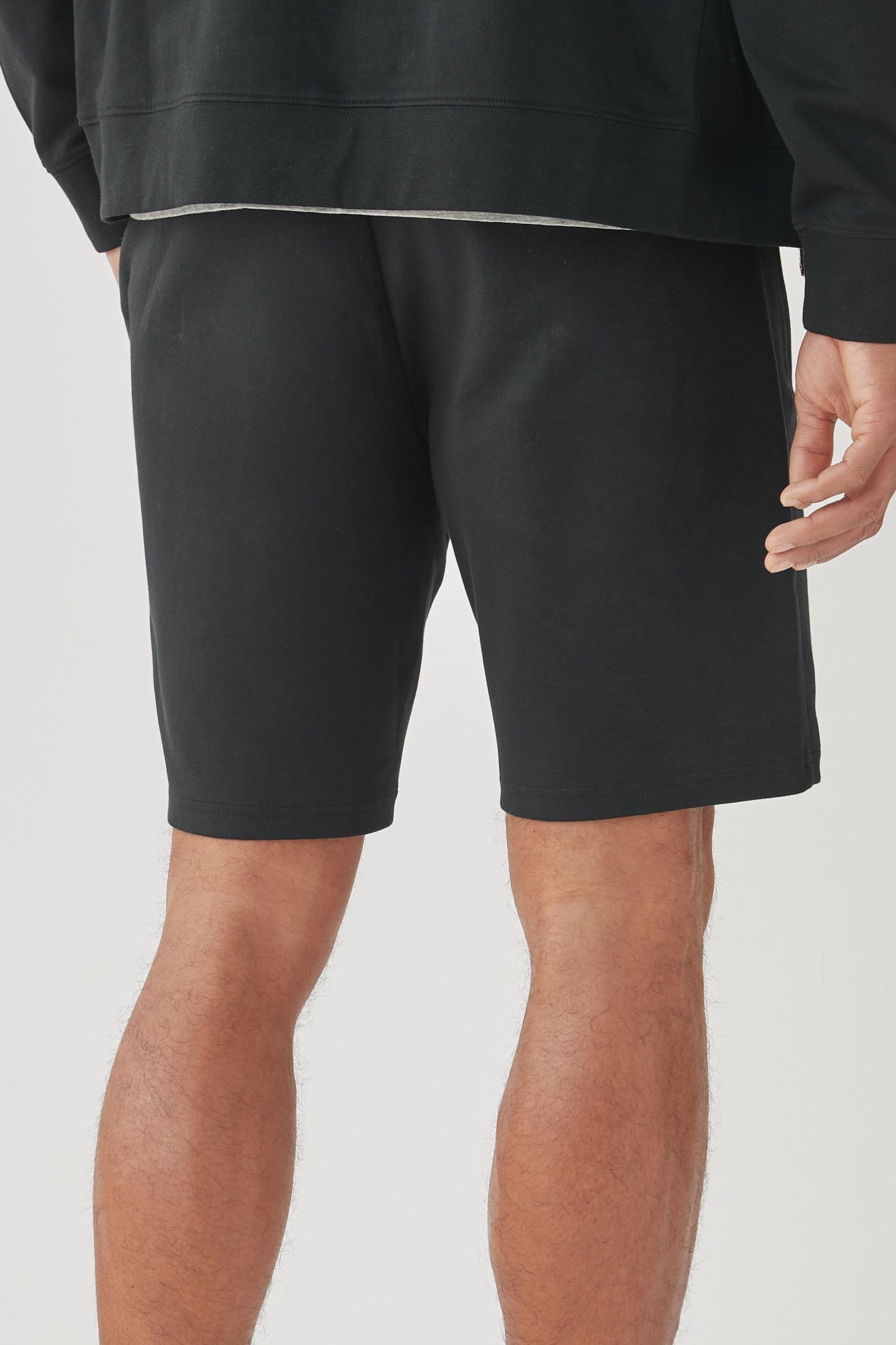 Next Sweatshorts Jersey-Shorts mit (1-tlg) Reißverschlusstaschen-Slim Black Fit