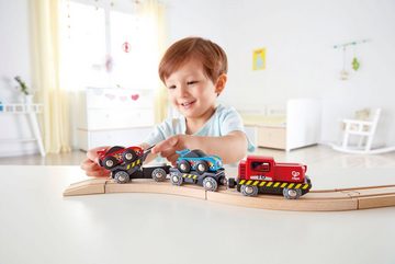 Hape Spielzeug-Eisenbahn Rennwagen-Transporter, FSC®- schützt Wald - weltweit