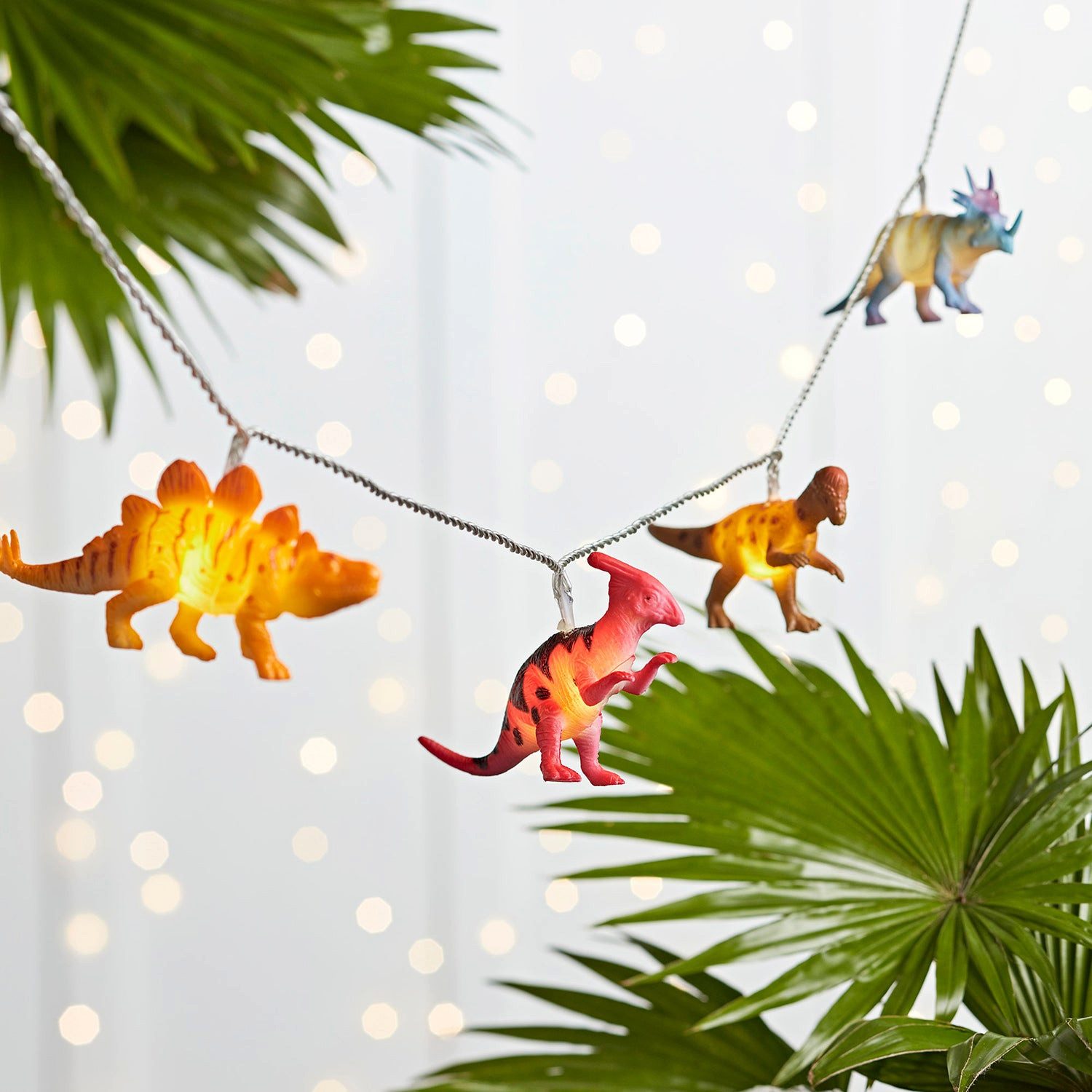 Lights4fun LED-Lichterkette 12er bunte Lichterkette Dinosaurier Batteriebetrieb