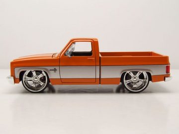 JADA Modellauto Chevrolet C-10 Pick Up 1985 orange grau Modellauto 1:24 Jada Toys, Maßstab 1:24