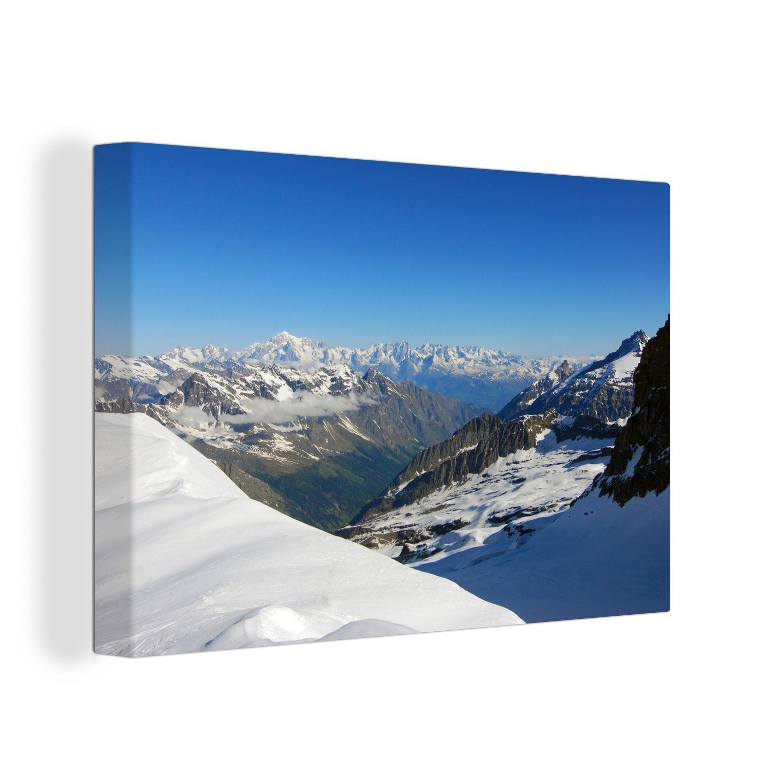 OneMillionCanvasses® Leinwandbild Ein blauer Himmel über den schneebedeckten Berggipfeln im, (1 St), Wandbild Leinwandbilder, Aufhängefertig, Wanddeko, 30x20 cm