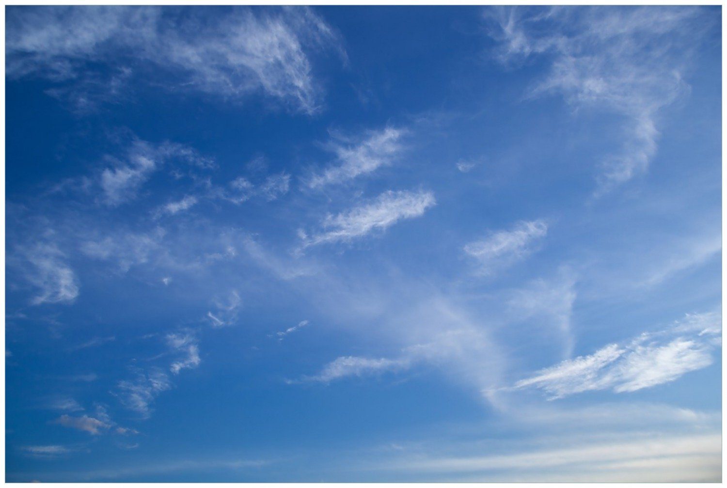 Wallario Poster, Blauer Himmel mit vereinzelten günstig online kaufen