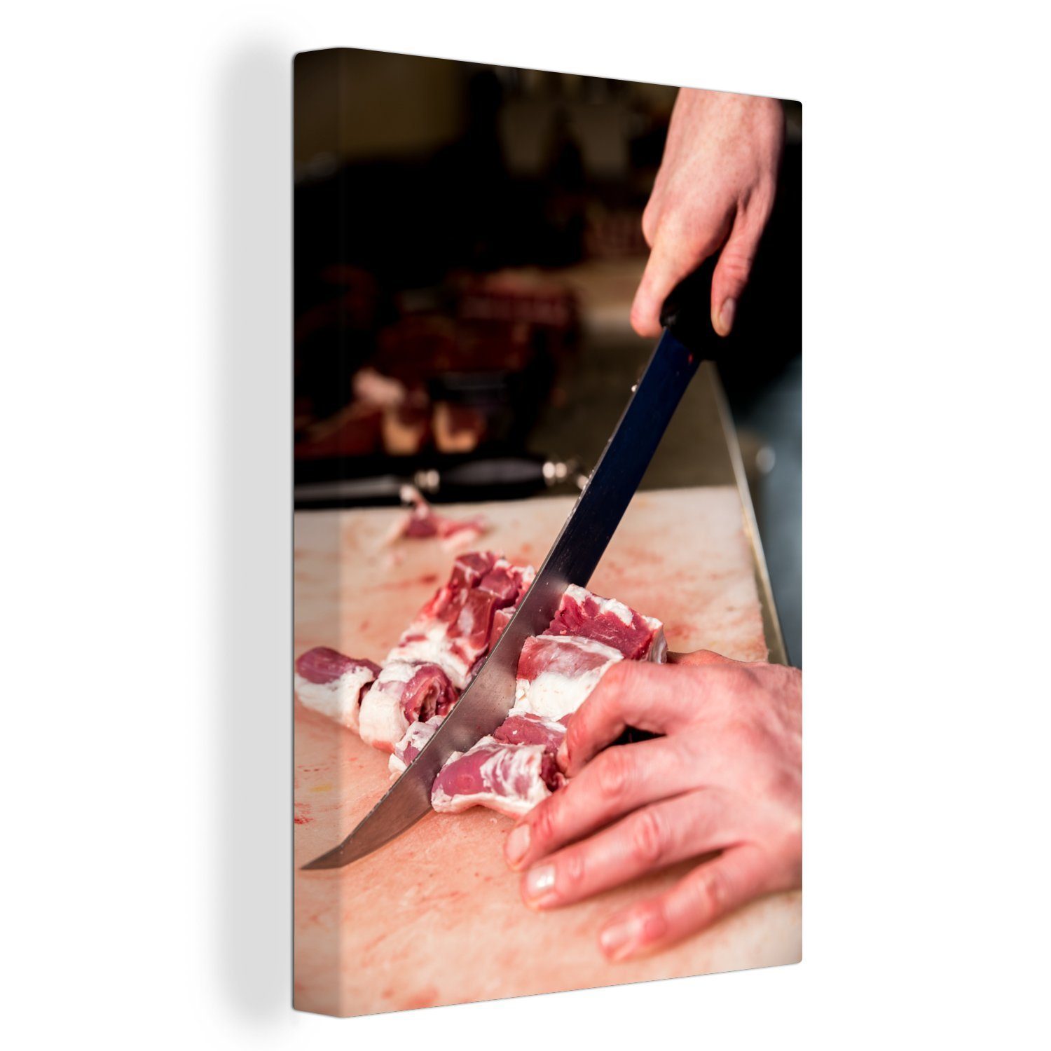OneMillionCanvasses® Leinwandbild Ein Fleischer Leinwandbild Gemälde, Zackenaufhänger, Fleisch mit das (1 einem fertig bespannt Messer, cm St), schneidet 20x30 inkl