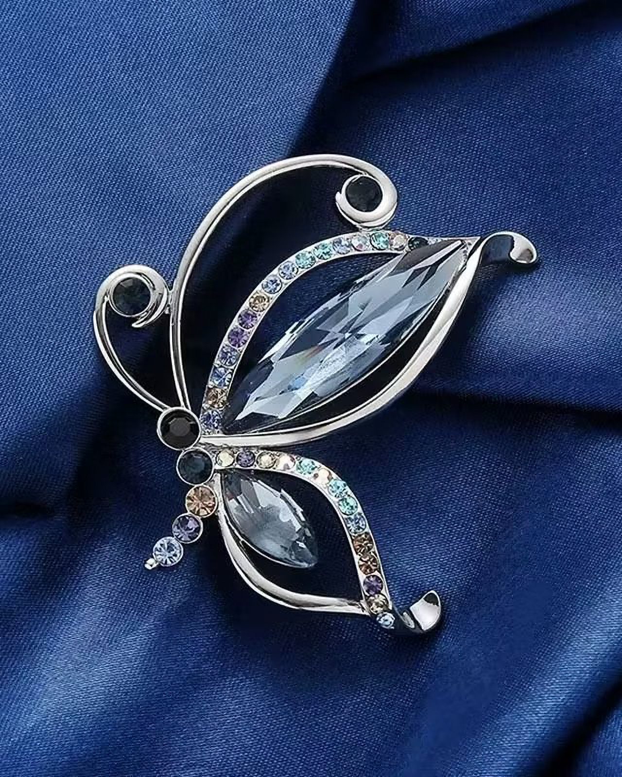 Form blau in mit Schmetterlings aus MayTree "Schmetterling", Glassteinen (1-tlg), Brosche Strass-Steinen blauen Metallbrosche eines
