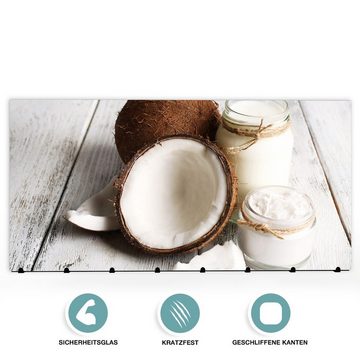 Primedeco Garderobenpaneel Magnetwand und Memoboard aus Glas Frisches Kokosöl