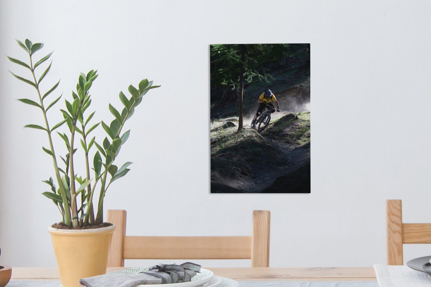 OneMillionCanvasses® Mountainbike cm fertig 20x30 Leinwandbild Zackenaufhänger, Gemälde, auf St), fährt Mann über Bodenwellen, inkl. (1 Leinwandbild bespannt