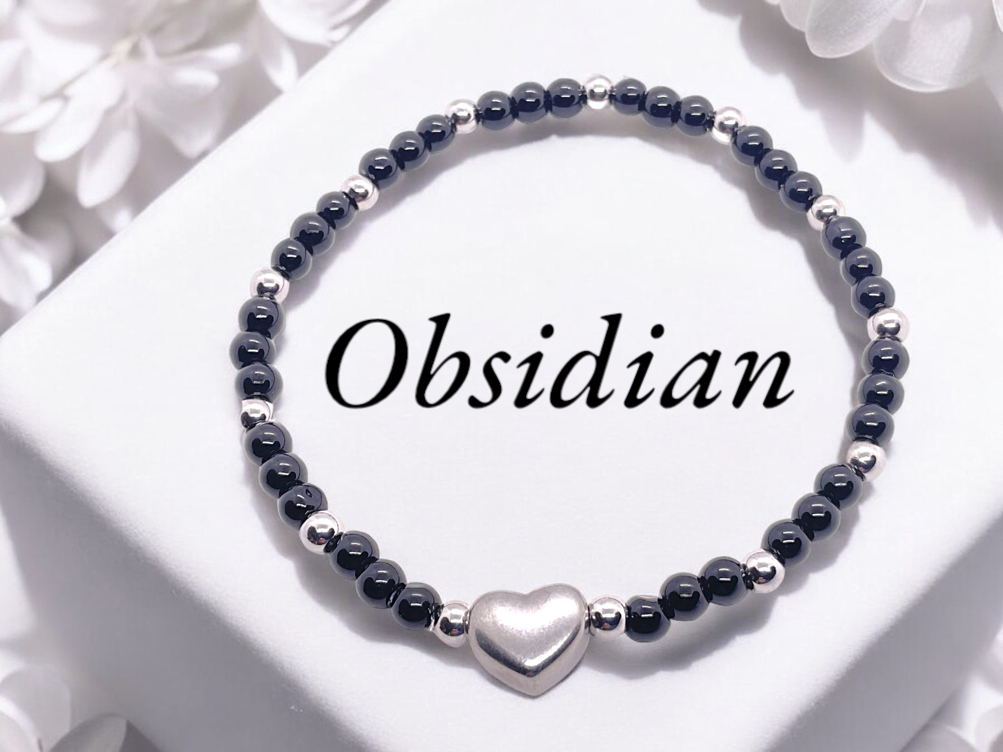 Steinfixx® Perlenarmband Obsidian Armband 4mm mit Edelstahlherz und Geschenkbox (mit 12 Edelstahlperlen je 4mm, 1-tlg., AAA-Qualität), incl. Edelsteinkarte