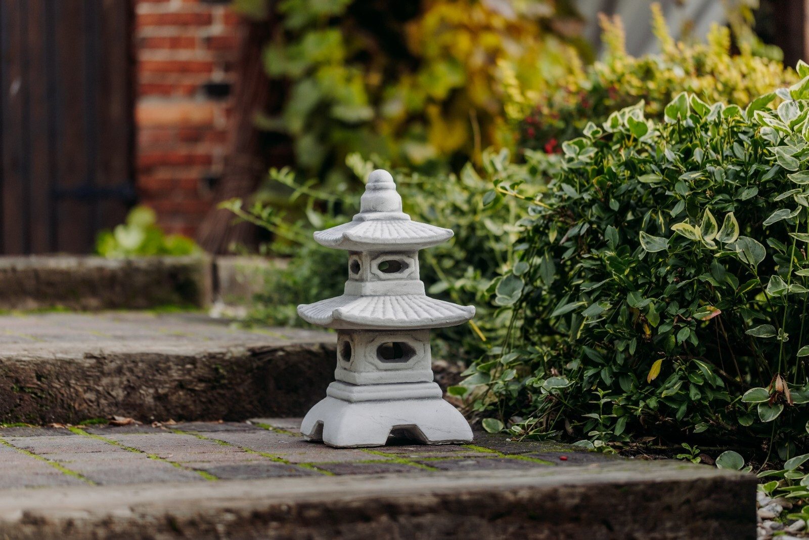 gartendekoparadies.de Gartenfigur Japanische Pagode mit acht günstig online kaufen