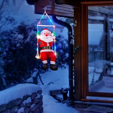 Raburg Weihnachtsmann auf Schaukel mit bunten LEDs, weiche XL Deko-Figur für Weihnachten, mit 20 bunten LEDs, 6 h Timer, ca. 60 cm groß, Gesamthöhe: ca. 90 cm