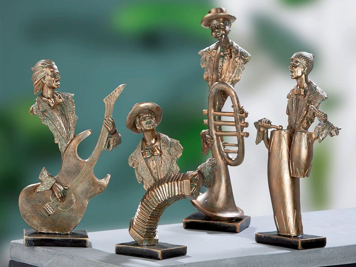 GILDE Dekoobjekt 3D Musiker Trommelspieler auf Musiker Base Serie goldfarben Figuren Gi