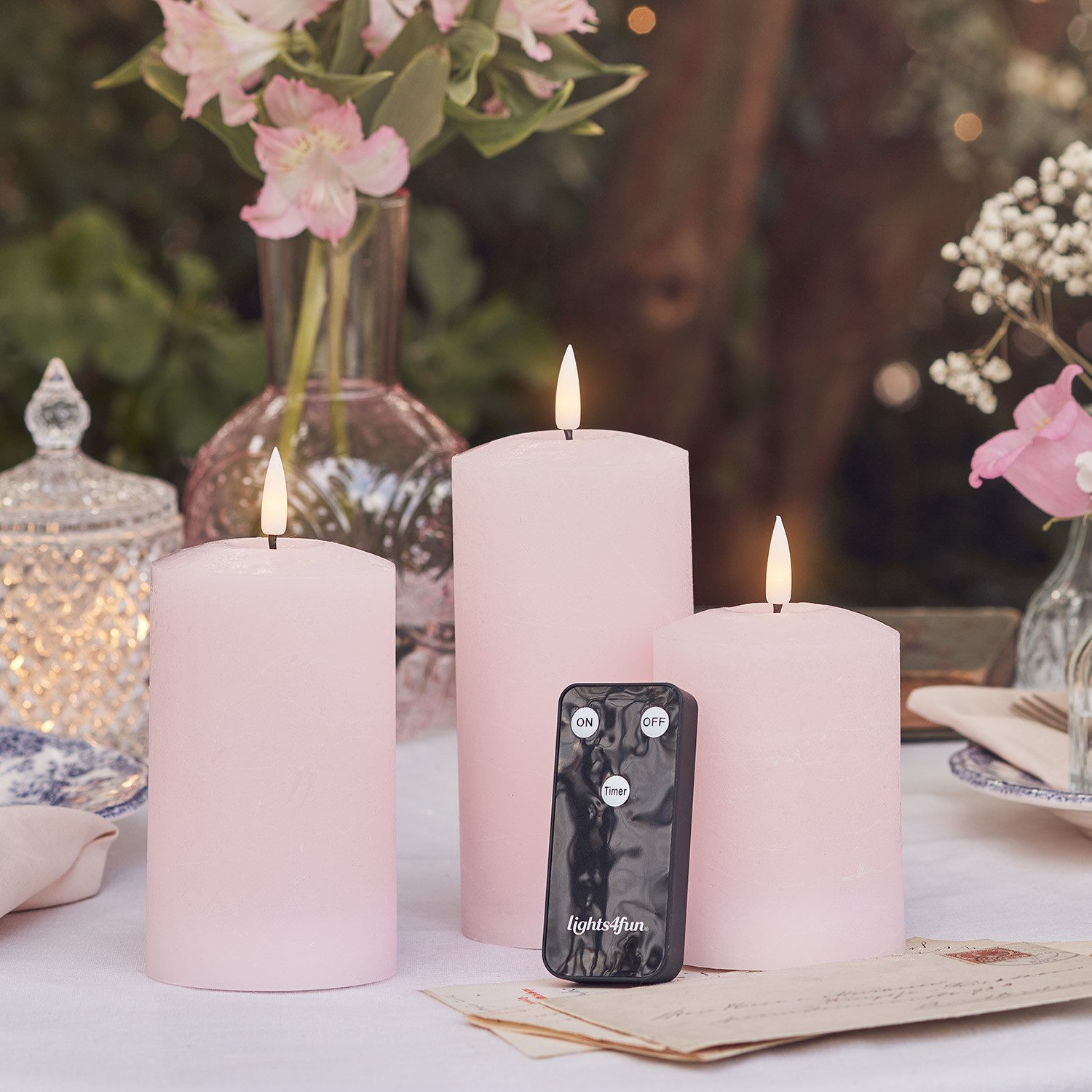Lights4fun LED-Kerze TruGlow® LED Kerzen Echtwachs Trio rosa mit Fernbedienung