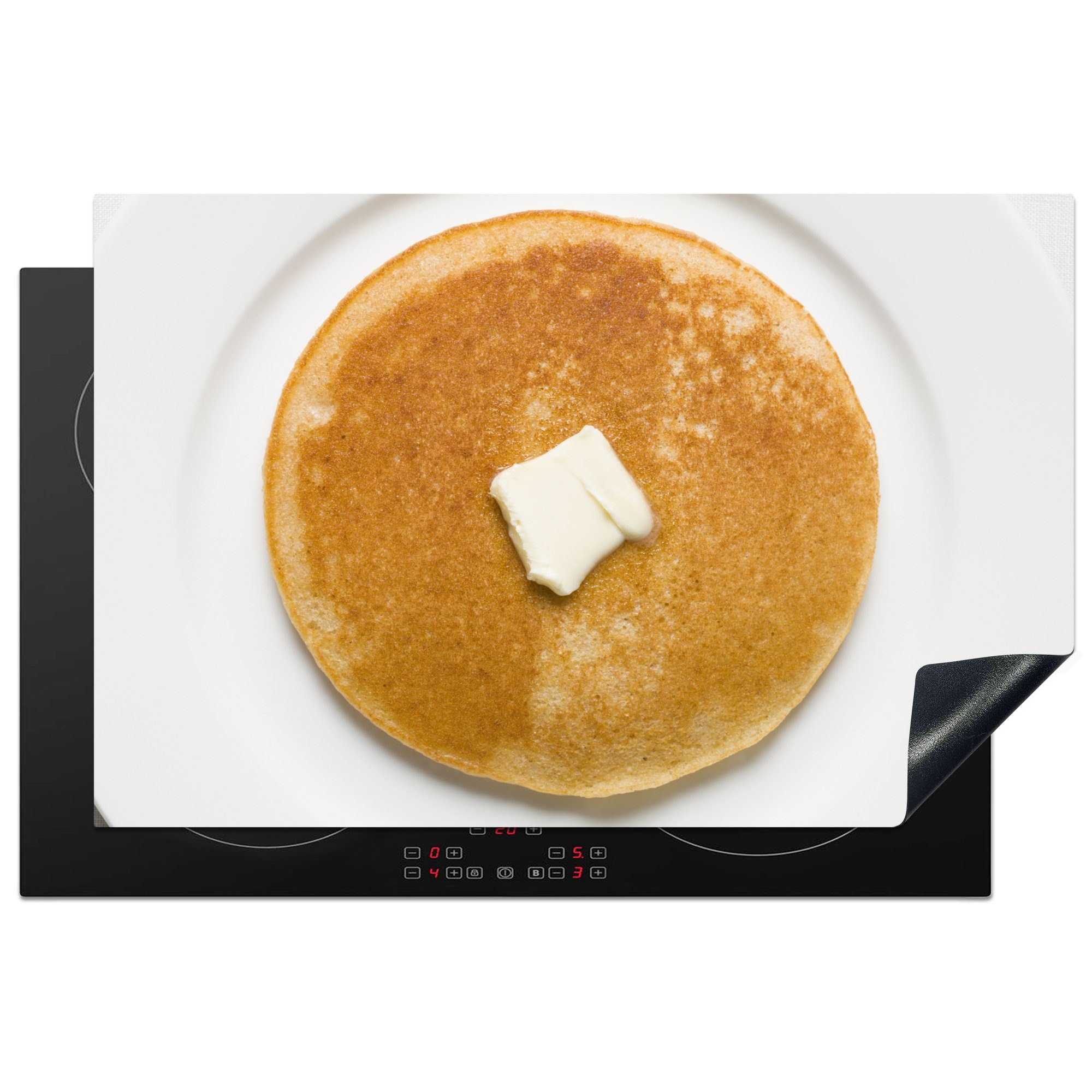 MuchoWow Herdblende-/Abdeckplatte Ein Pfannkuchen mit Butter auf einem Teller, Vinyl, (1 tlg), 81x52 cm, Induktionskochfeld Schutz für die küche, Ceranfeldabdeckung