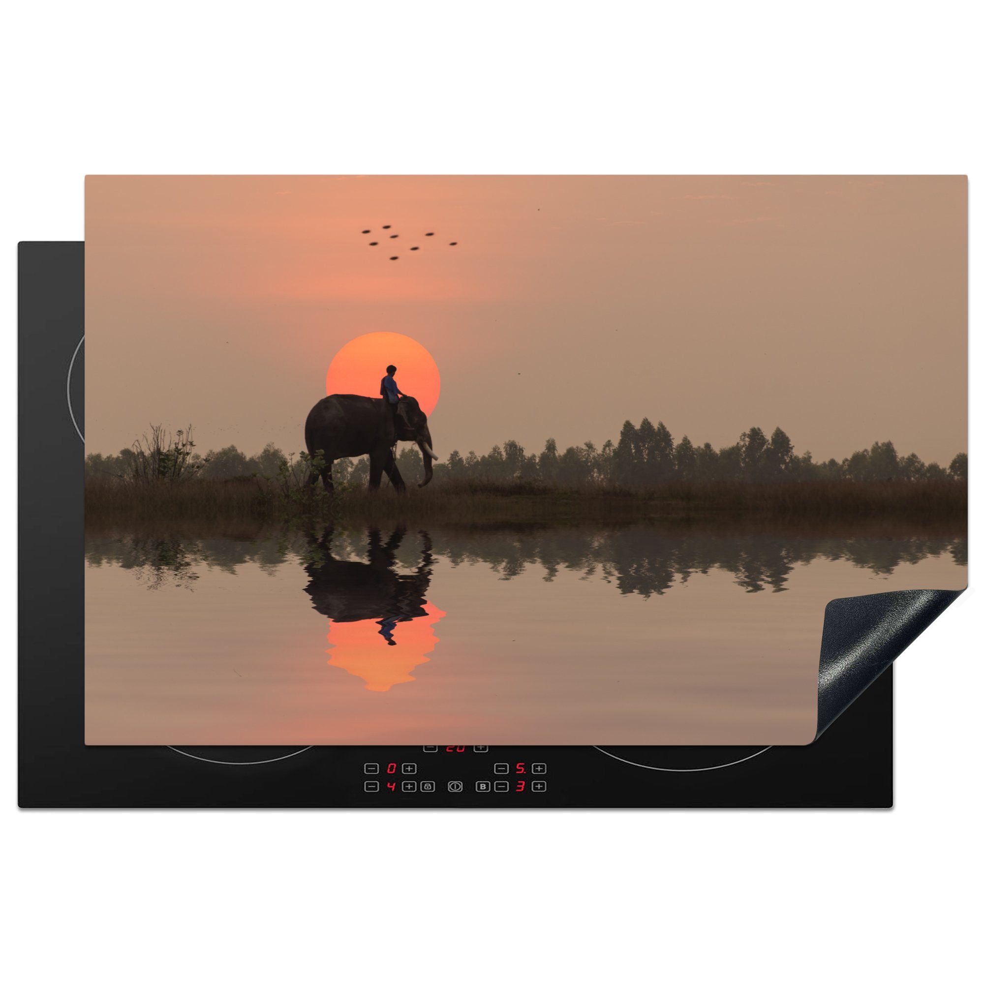 MuchoWow Herdblende-/Abdeckplatte Ein Elefant in einem Reisfeld bei Sonnenuntergang in Thailand, Vinyl, (1 tlg), 81x52 cm, Induktionskochfeld Schutz für die küche, Ceranfeldabdeckung