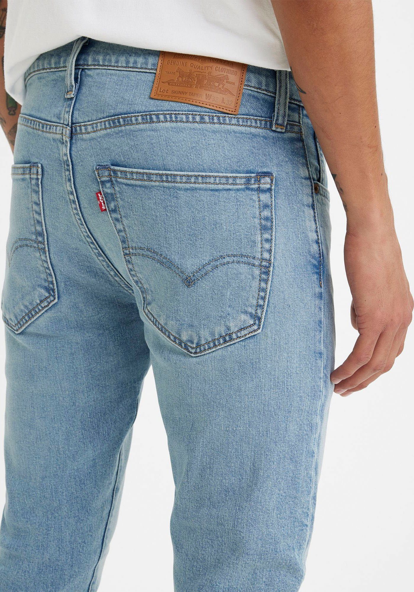 Levi's® light mit SKINNY worn Skinny-fit-Jeans Markenlabel indigo TAPER in