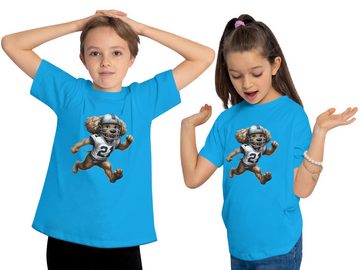 MyDesign24 T-Shirt Kinder Print Shirt rennender Hund im American Football Dress Bedrucktes Jungen und Mädchen American Football T-Shirt, i500