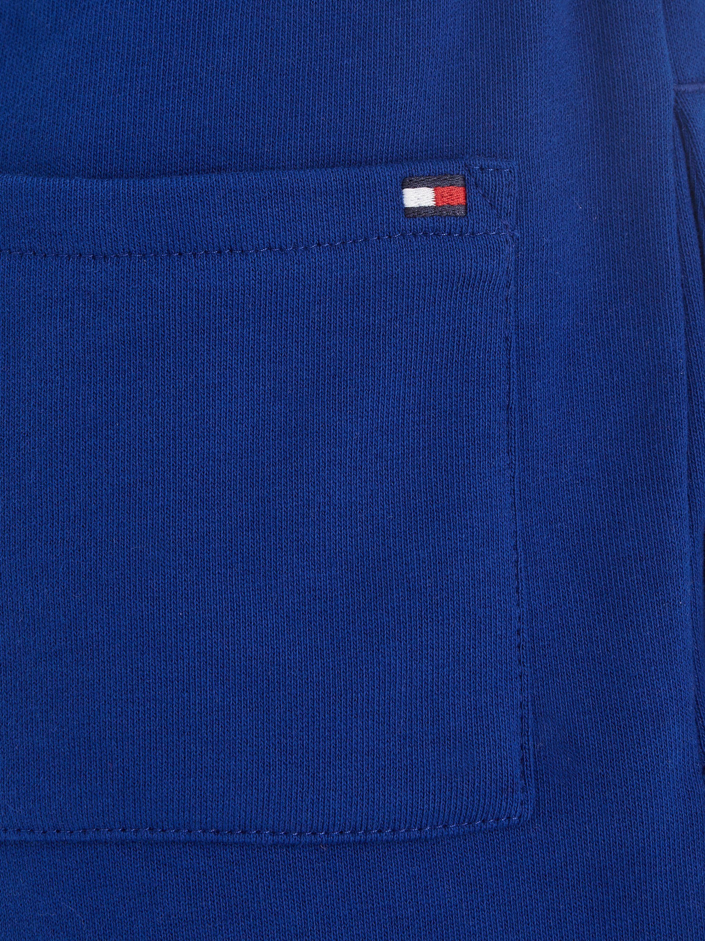 ESSENTIAL Hilfiger Tommy linken U Tommy Sweathose mit SWEATPANTS Bein auf Hilfiger dem Logo-Schriftzug