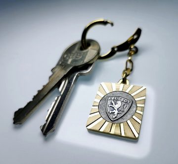 HR Autocomfort Schlüsselanhänger Original 1957 Schlüsselanhänger PEUGEOT Lüfterrad Anhänger Metall Diamantschliff