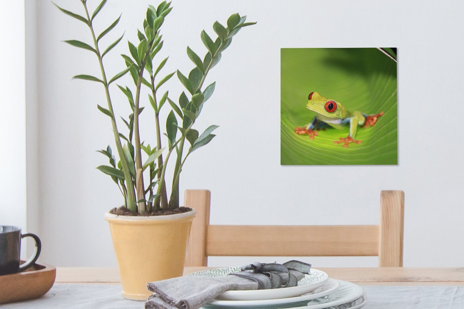 OneMillionCanvasses® auf St), Blatt für (1 Schlafzimmer Rica, Leinwand Leinwandbild einem Rotaugen-Ara-Frosch Wohnzimmer in Bilder Costa