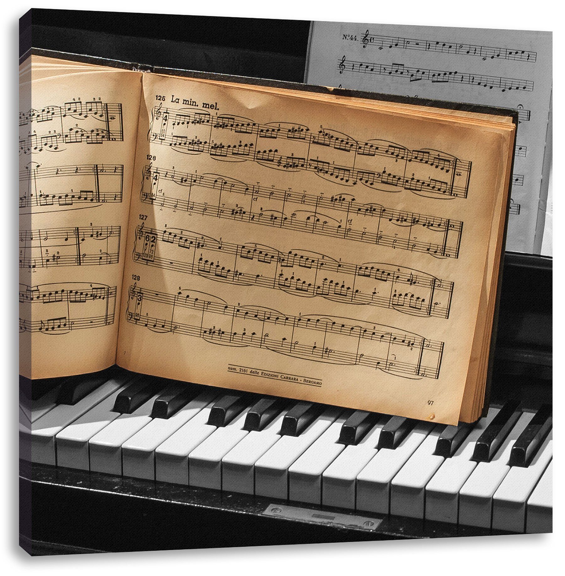 Leinwandbild Notenbuch auf Piano