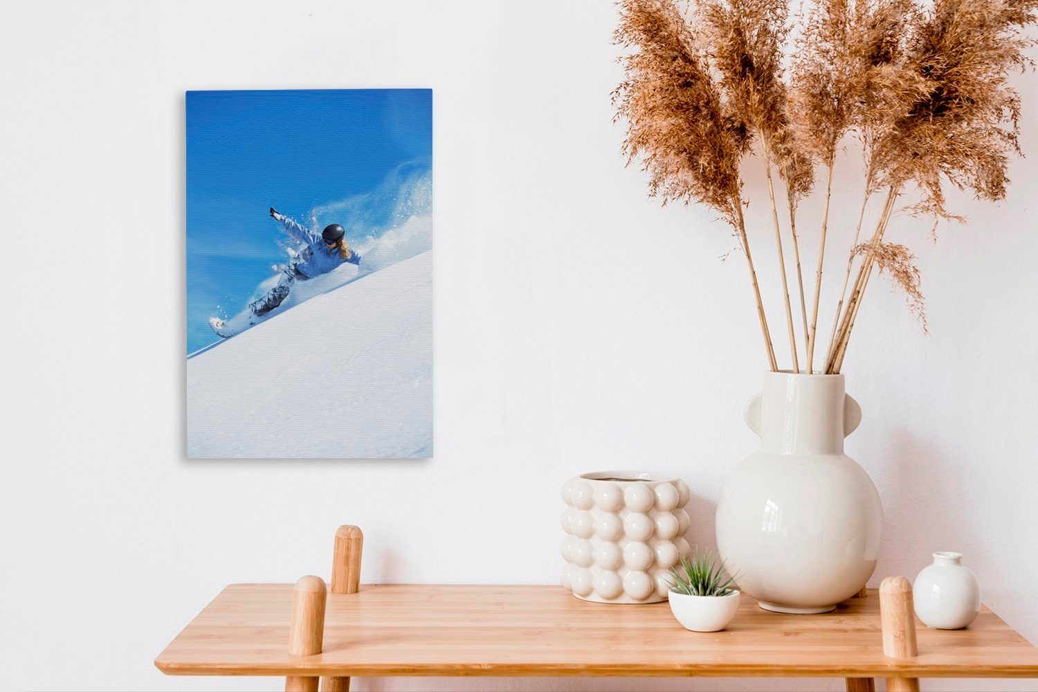 Leinwandbild in Ein 20x30 Berg Snowboarder St), Zackenaufhänger, inkl. Leinwandbild die cm fertig Tiefe, Gemälde, bespannt stürzt (1 einem von OneMillionCanvasses®