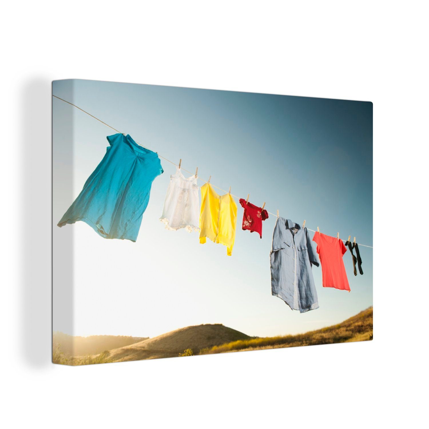 OneMillionCanvasses® Leinwandbild Frauenkleidung auf einer Wandbild Aufhängefertig, St), Wäscheleine, 30x20 Leinwandbilder, cm (1 Wanddeko