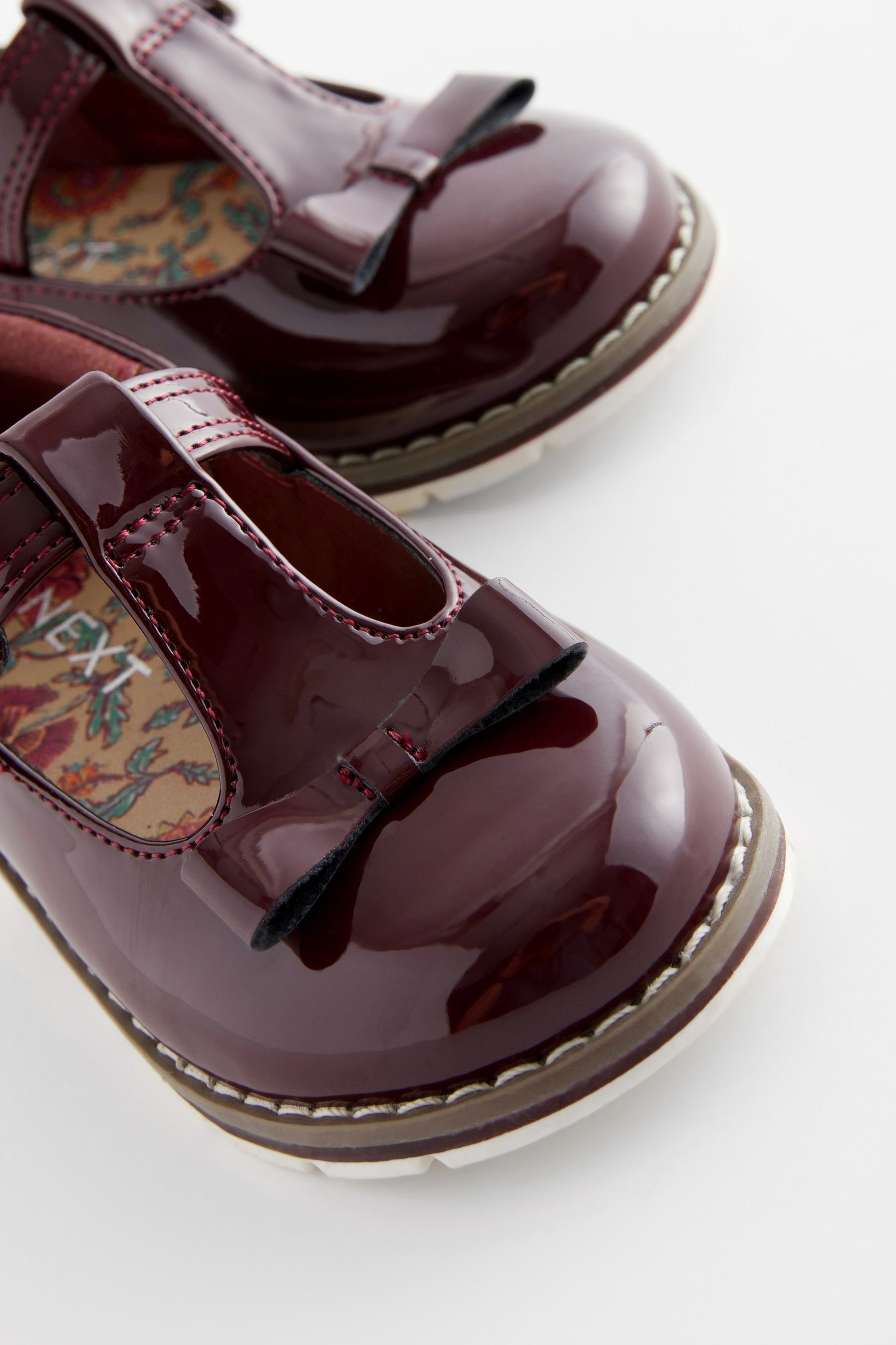 Patent (1-tlg) T-Strap-Sandale Next mit und Purple Schuhe T-Steg Plum Schleife