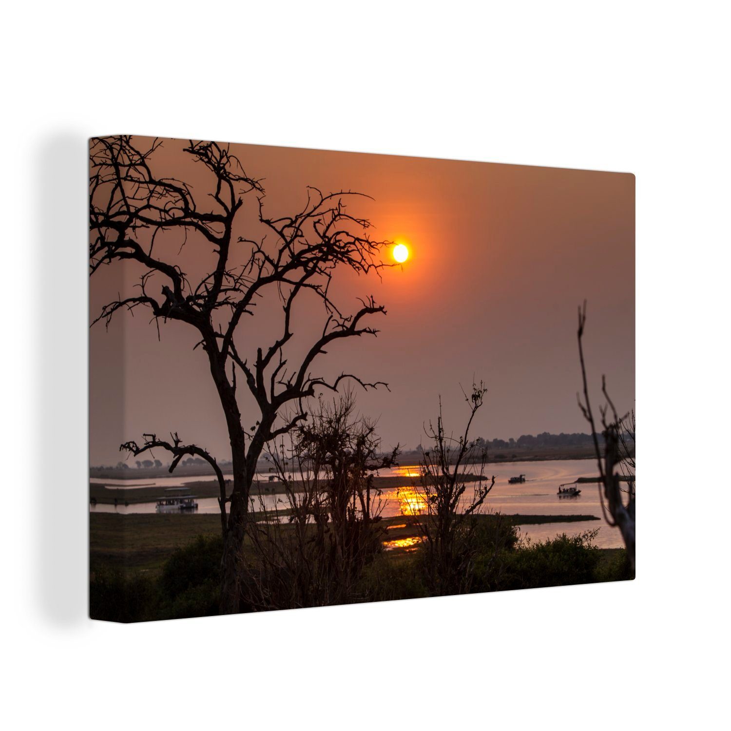 OneMillionCanvasses® Leinwandbild Silhouette von Bäumen am Serondela-Fluss bei Sonnenuntergang im, (1 St), Wandbild Leinwandbilder, Aufhängefertig, Wanddeko, 30x20 cm