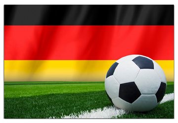 Wallario Wandfolie, Fußball vor einer Deutschlandflagge, wasserresistent, geeignet für Bad und Dusche