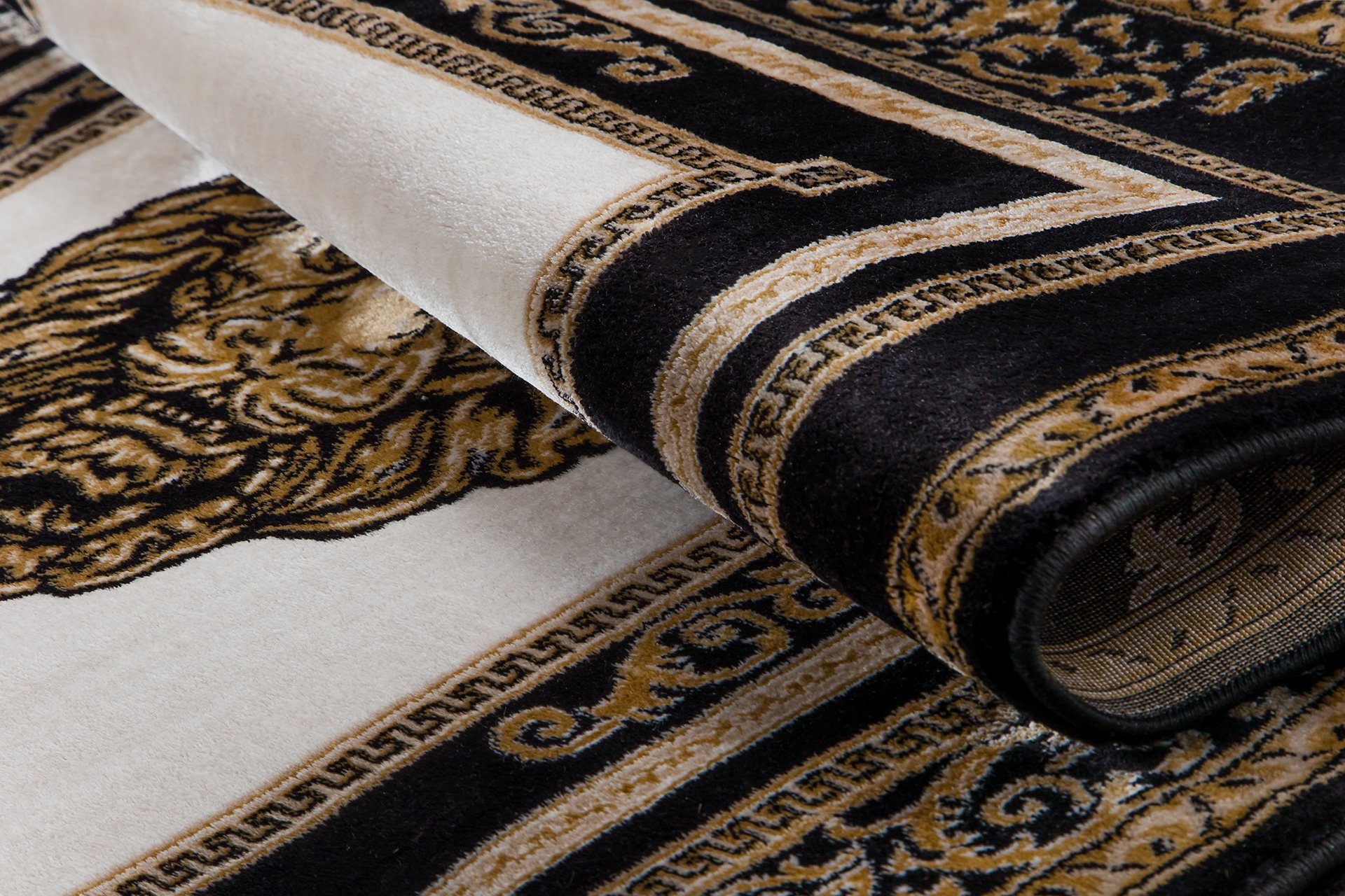 Belle Arti Teppich Teppich Wohnzimmer Wohnzimmerteppich Löwenkopf Löwe Motiv schwarz gold, Kurzflor, Anti-Rutsch, orientalisch, Mäander Muster, Seidenoptik