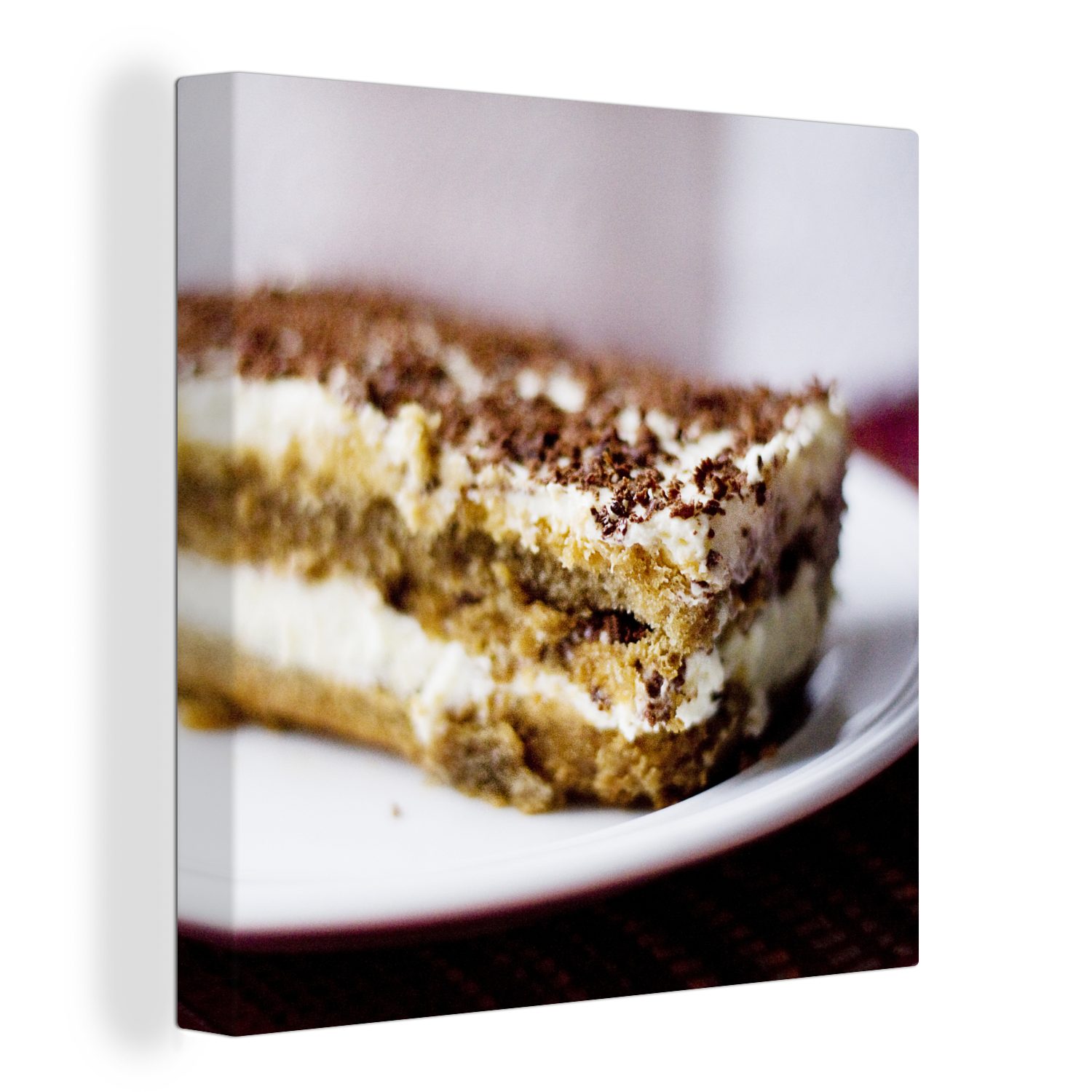 OneMillionCanvasses® Leinwandbild Nahaufnahme eines Stücks Tiramisu-Kuchen, das auf einem Teller liegt, (1 St), Leinwand Bilder für Wohnzimmer Schlafzimmer