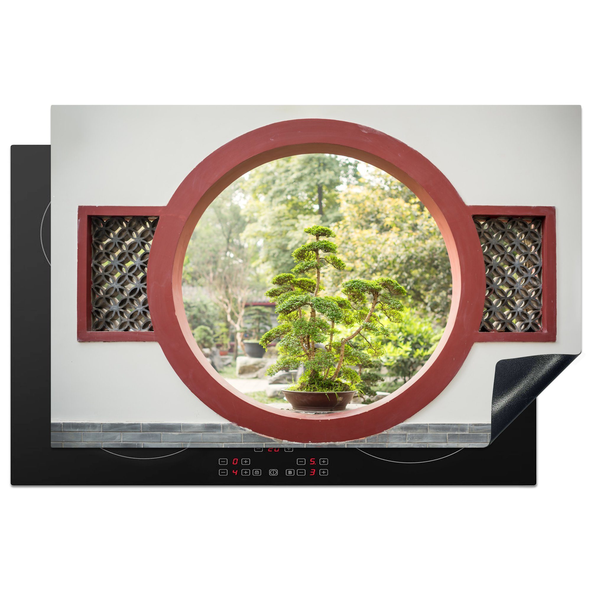 MuchoWow Herdblende-/Abdeckplatte Blick auf Bonsaibäume durch ein rundes Fenster, Vinyl, (1 tlg), 81x52 cm, Induktionskochfeld Schutz für die küche, Ceranfeldabdeckung