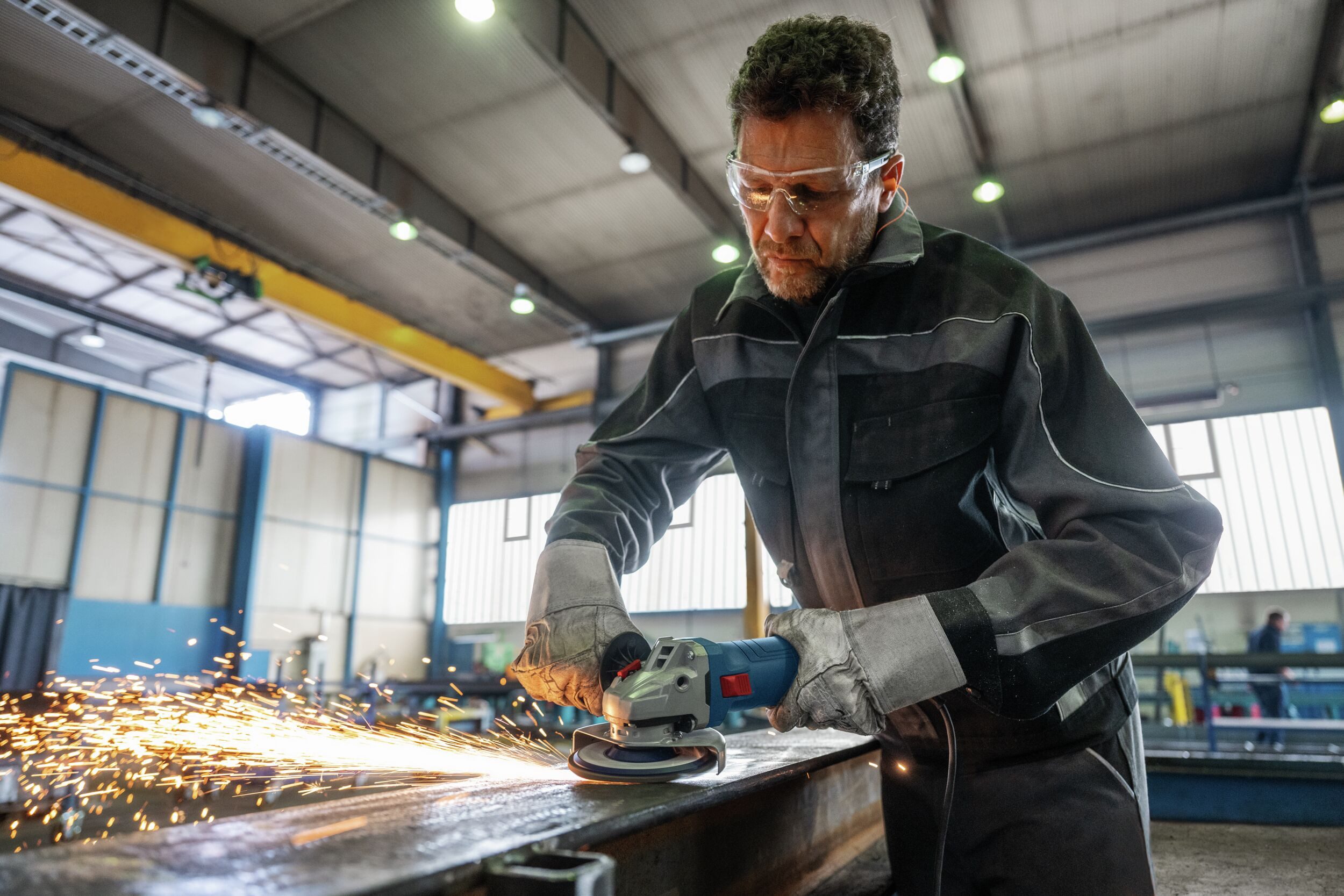 BOSCH Winkelschleifer GWS 12-125, max. 11000 U/min, Mit Schruppscheibe - im Karton