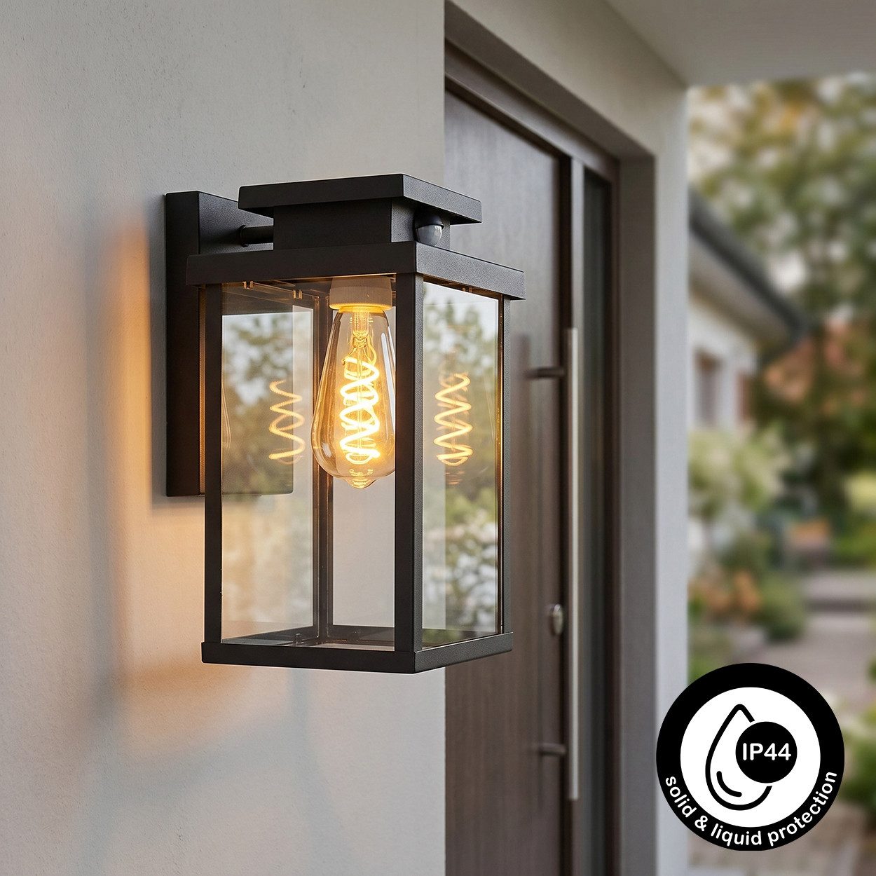 hofstein Außen-Wandleuchte »Poggio« moderne Wandlampe mit Bewegungsmelder, ohne Leuchtmittel, Metall/Glas in Schwarz/Klar, E27, Außenleuchte, m. Lichteffekt, IP44